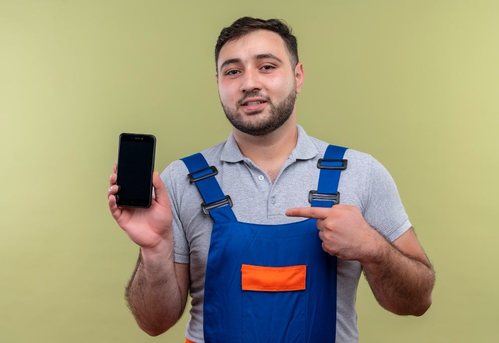 Handyman provider points a finger at his mobile